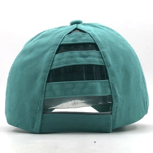 Detail view of the multi-layered elastic straps for high ponytail on a teal cotton cap