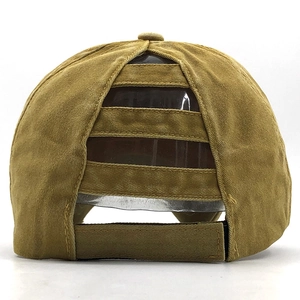 Detail view of khaki cotton baseball cap with elastic ponytail hole and velcro strap
