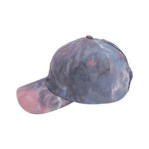 Detail view of a tie-dye ponytail baseball cap with blue and red patterns
