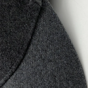 Dark grey cashmere baseball cap with detailed stitching and premium wool texture