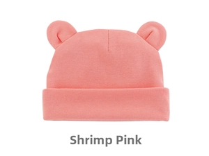 Detail of soft shrimp pink cotton knit infant hat with cute bear ears and folded cuff