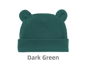 Close-up of a dark green baby knit hat featuring cute Mickey bear ears and folded brim