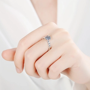 Classic S925 sterling silver six-prong moissanite ring with side stones on model hand