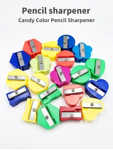 Close-up of assorted candy-colored geometric pencil sharpeners in various shapes and colors