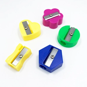 Mini colorful manual pencil sharpeners for students in multiple plastic shapes and vibrant hues