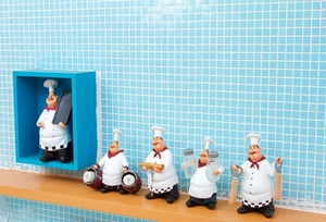 Detailed resin chef figurines set featuring wine openers and spice racks on a shelf