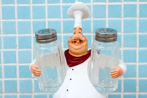 Detail of chef figurine spice rack holder with two glass salt and pepper shakers