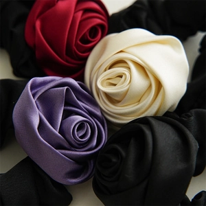 Set of four satin rose flower hair scrunchies in red, white, purple, and black colors