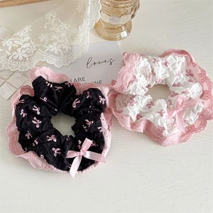 Set of black and white lace scrunchies with pink bow prints and ribbon detail