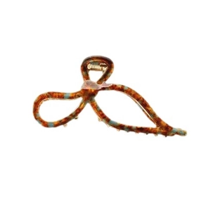 Elegant tortoiseshell acetate hair claw clip with bow design and blue speckle pattern