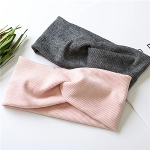 Pink and dark grey knitted twist headbands with ribbed texture for women