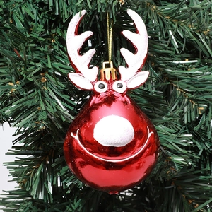Red Christmas reindeer ornament with gold string hanging on a festive tree branch