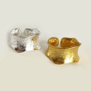 Irregular lava textured open rings in gold and silver finish with geometric molten surface