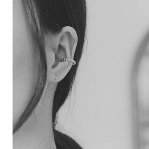 Macro shot of minimalist 18K gold plated beaded ear cuff for non-pierced ears