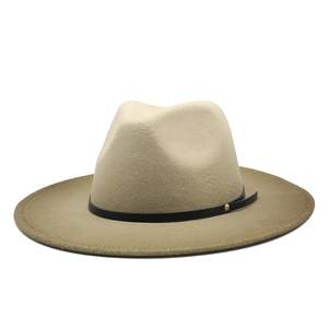 Classic light camel wool fedora hat with a thin black leather band and gold rivet