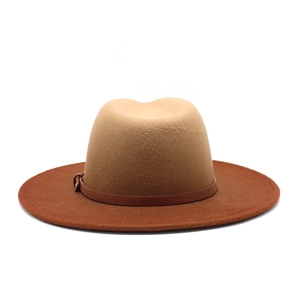 Detail of wool fedora with gradient two-tone crown and brown leather strap buckle