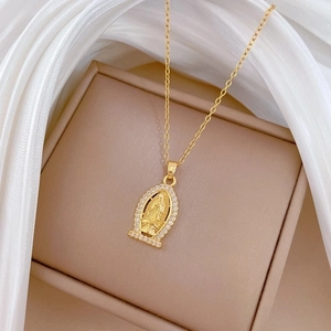 Luxurious gold-tone Virgin Mary pendant necklace with sparkling rhinestones on silk