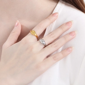 Detailed close-up of gold and silver stainless steel rings featuring eight-pointed star designs