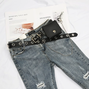 Detail of punk black PU leather belt with detachable mini pouch and silver metal chain