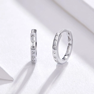 Close-up of S925 sterling silver hoop earrings with sparkling white cubic zirconia