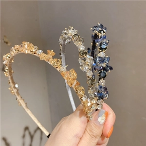 Detail of handmade crystal cluster headbands with shimmering rhinestones and fine metal frames