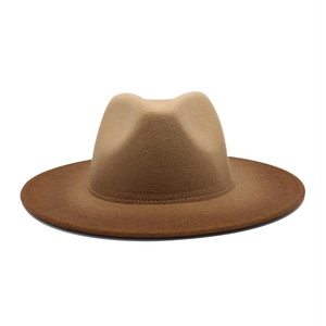 Close-up of wide brim wool fedora hat featuring a brown gradient finish and fine stitching