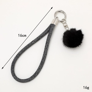 Porte-clés en denim noir avec boule en fausse fourrure et dimensions 16cm 16g