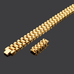 Macro shot of gold President-style metal watch links with brushed and polished texture