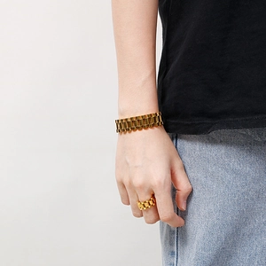 Detail of 15mm gold vacuum-plated stainless steel watchband-style bracelet and ring set