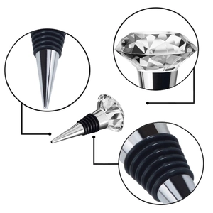 Elegant diamond-cut crystal wine stopper with a polished metal base and rubber seals