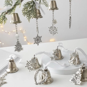Vintage iron Christmas bell ornament with snowflake and reindeer motifs for holiday trees