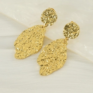 Vintage gold irregular leaf earrings with hammered texture on white silk background