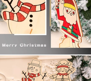Detail of Christmas wooden ornaments with red glitter finish and standing brackets