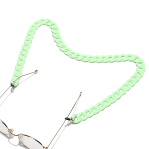 Close-up of light green acrylic eyeglass chain with silicone loops and gold metal buckle