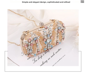 Detailed macro view of champagne evening bag with colorful gemstones and crystal ball clasp
