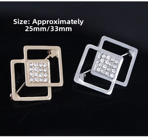 Detail view of gold and silver square geometric brooches with sparkling crystals