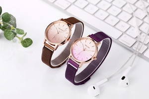 Elegant gradient floral dial ladies quartz watches with magnetic mesh straps on desk