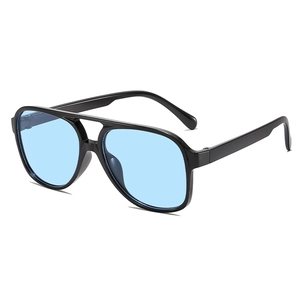 Retro double-bridge pilot sunglasses with large black frames and light blue lenses