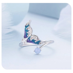 Macro shot of S925 sterling silver mermaid tail ring with blue enamel and zircons