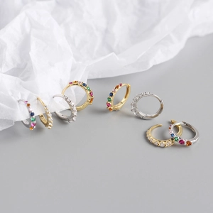 Macro shot of S925 sterling silver hoop earrings with multicolor zircon stones