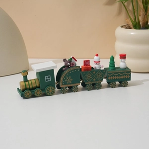 Green wooden Christmas train decoration with miniature Santa Claus and snowman figurines