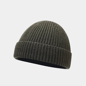 Detailed view of the olive green ribbed knit texture and premium stitching on the beanie hat