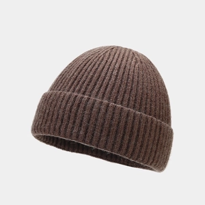 Detailed view of the ribbed knit texture and fiber finish on a dark brown beanie cap