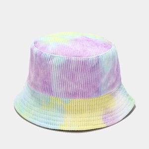 Detailed texture of tie-dye corduroy fabric on a soft pastel multi-color bucket hat