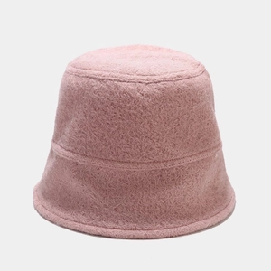 Detailed view of soft pink faux shearling bucket hat with plush texture and warm material