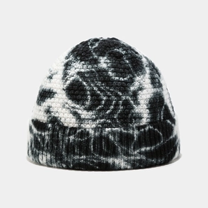 Detailed view of the black and white tie-dye knit texture on this winter docker hat