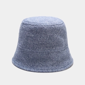 Close-up of light blue plush bucket hat featuring soft textured lamb wool material