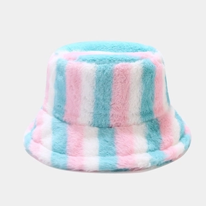 Detail of colorful rainbow striped plush bucket hat with soft pastel pink and blue textures