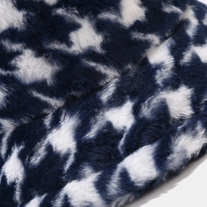 Blue houndstooth faux fur bucket hat with thick plush texture for winter warmth