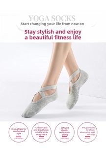 Detail showing elastic criss-cross straps and PVC non-slip dots on grey yoga socks